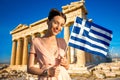 Woman with Greek flag on Parthenon background Royalty Free Stock Photo