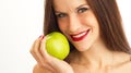 Woman Holds Green Apple Up to Smiling Face