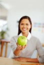 Woman, green apple and fruit for a healthy lifestyle, diet and eating for health and wellness while sitting at home with Royalty Free Stock Photo