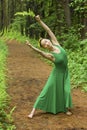 Woman in green dress, dancing in the Connecticut woods Royalty Free Stock Photo