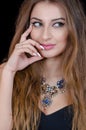 Woman with green eye contact lens , long hair and big necklace Royalty Free Stock Photo