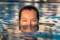 Woman with green eyes in the pool Royalty Free Stock Photo