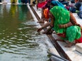 A woman in a green sari washes her face at jama masjid mosque in delhi Royalty Free Stock Photo