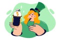 Woman in green suit in honor of St. Patricks day holiday shows bowler hat with bag of money