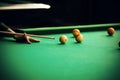 A woman holds a cue and aims at a billiard ball Royalty Free Stock Photo