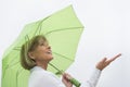 Woman With Green Umbrella Enjoying Rain Against Clear Sky Royalty Free Stock Photo