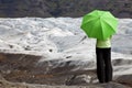 Woman With Green Umbrella By Glacier