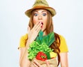 Woman with green vegan food. paper bag. surprise emotion. Royalty Free Stock Photo