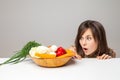 Woman with green vegan food. surprise emotion.