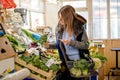 Woman in greengrocer`s shop