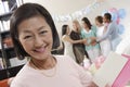 Woman With Greeting Card At A Baby Shower Royalty Free Stock Photo