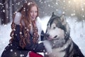The woman in grey coat with a dog or wolf. Royalty Free Stock Photo