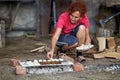 Woman grilling shrooms and sausages