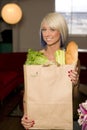 Blond Woman paper grocery bag fresh groceries Royalty Free Stock Photo