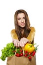 Woman with a grocery shopping bag. Isolated on white backg Royalty Free Stock Photo