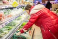 Woman grocery shopping at the supermarket. self-service