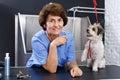 Woman groomer with cute dog Royalty Free Stock Photo