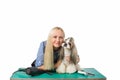 Woman groomer with funny and cute shih-tzu dog Royalty Free Stock Photo