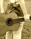woman guitar behind back Royalty Free Stock Photo