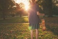 Woman with guitar at sunset in the park Royalty Free Stock Photo