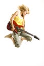 Woman guitarist jumps in the air