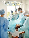 Woman on gurney in operating room.