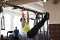 Woman at the gym doing exercises the legs to the top Royalty Free Stock Photo