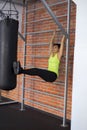 Woman at the gym doing exercises the legs to the top Royalty Free Stock Photo