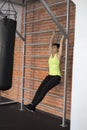 Woman at the gym doing exercises the legs to the top Royalty Free Stock Photo