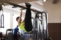 Woman at the gym doing exercises the legs to the top Royalty Free Stock Photo