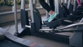 Woman at the gym exercising on the xtrainer machine