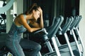 Woman in the gym with overtraining symptoms Royalty Free Stock Photo