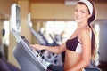 Woman, gym portrait and treadmill with smile, start button and happy for fitness, wellness and health. Girl runner