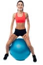 Woman in gym relaxing on pilates ball Royalty Free Stock Photo