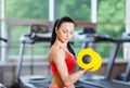 Woman in gym sport exercising with dumbbells Royalty Free Stock Photo