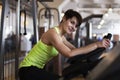 Woman in the gym on a stationary bike Royalty Free Stock Photo