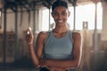 Woman in gym, thumbs up with smile in portrait, like fitness with emoji and health goals with sport and mockup space Royalty Free Stock Photo