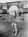 Woman in gymnasium with huge ball Royalty Free Stock Photo