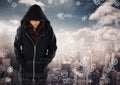 Woman hacker hooded standing on in front of digital background