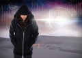 Woman hacker hooded standing on in front of digital background