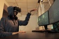 Woman hacking databse in metaverse, coding in vr glasses Royalty Free Stock Photo