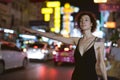 Woman hailing a cab on the road