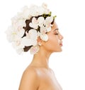 Woman Hair Flower Treatment. Beauty Model in Orchid Floral Crown Hairstyle Profile Side view over isolated White Background Royalty Free Stock Photo
