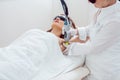 Woman during hair removal using modern laser technology