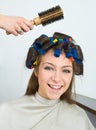 Woman with hair rollers