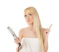 Woman with hair straighteners Royalty Free Stock Photo