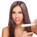 Woman with hair straightening irons