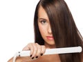 Woman with hair straightening irons