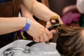 Woman hair stylist washing customers hair at hairdressing salon - close up Royalty Free Stock Photo