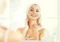 Woman in hairband touching her face at bathroom Royalty Free Stock Photo